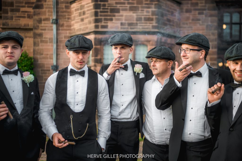 groomsmen enjoying post-meal cigars Peaky blinders style